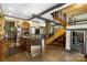 Modern kitchen with stainless steel appliances and a large island with bar seating and concrete flooring at 14701 Cabarrus Rd, Mint Hill, NC 28227
