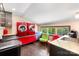Bright laundry room with red washer and dryer, stainless steel countertops, and window at 14701 Cabarrus Rd, Mint Hill, NC 28227