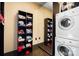 Well-organized laundry area with washer/dryer and built-in shelving for storage at 14701 Cabarrus Rd, Mint Hill, NC 28227