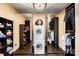 Organized laundry room with washer/dryer, mirrored closets, and ample storage space at 14701 Cabarrus Rd, Mint Hill, NC 28227