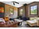 Living area featuring a cozy blue wood-burning stove and comfortable sofa at 14701 Cabarrus Rd, Mint Hill, NC 28227