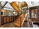 Striking wood staircase with metal railings, providing access to upper levels and enhancing the home's architectural appeal at 14701 Cabarrus Rd, Mint Hill, NC 28227
