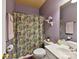 Cozy full bathroom featuring shower-tub combo and ample counter space at 1564 Trippett Nw St, Concord, NC 28027