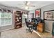 This functional bedroom features a ceiling fan, natural light, and carpeted floors, perfect for a home office at 1564 Trippett Nw St, Concord, NC 28027