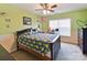 Cozy bedroom with green walls, natural light and a comfortable feel at 1564 Trippett Nw St, Concord, NC 28027