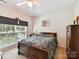 Comfortable bedroom with natural light, ceiling fan, and ample closet space at 1564 Trippett Nw St, Concord, NC 28027