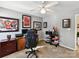 This functional bedroom features a ceiling fan and carpeted floors, perfect for a home office at 1564 Trippett Nw St, Concord, NC 28027