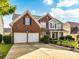 Lovely two-story brick home with three-car garage and mature landscaping at 1564 Trippett Nw St, Concord, NC 28027