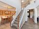 Bright open foyer featuring a staircase and dining room view at 1564 Trippett Nw St, Concord, NC 28027