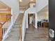 Grand foyer with staircase, hardwood floors, and an open, airy design at 1564 Trippett Nw St, Concord, NC 28027