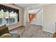 Cozy living room with hardwood floors and large windows allowing natural light at 1564 Trippett Nw St, Concord, NC 28027