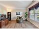 Comfortable living room featuring hardwood floors and a cozy seating area at 1564 Trippett Nw St, Concord, NC 28027