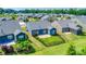 Aerial view of the blue home featuring a patio, fenced yard, and landscaping at 1636 Red Leaf Dr, Fort Mill, SC 29715