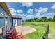 Landscaped backyard features a patio, fenced yard, and views of a lush green common area at 1636 Red Leaf Dr, Fort Mill, SC 29715