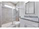 This bathroom features a granite countertop, white vanity, tiled shower, and chrome fixtures at 1636 Red Leaf Dr, Fort Mill, SC 29715