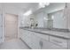 Bathroom featuring double vanity with stone countertop and a large mirror at 1636 Red Leaf Dr, Fort Mill, SC 29715