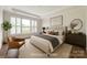 Staged bedroom with large window and tray ceiling at 1636 Red Leaf Dr, Fort Mill, SC 29715