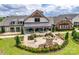 Stunning clubhouse features a spacious patio with outdoor seating and manicured landscaping at 1636 Red Leaf Dr, Fort Mill, SC 29715
