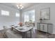 Bright dining room with a marble table, decorative wainscoting, and hardwood floors at 1636 Red Leaf Dr, Fort Mill, SC 29715