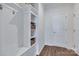 Hallway featuring built-in storage with shelving, coat hooks, and light hardwood flooring at 1636 Red Leaf Dr, Fort Mill, SC 29715