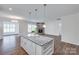 Open-concept kitchen with a view of the living room and fireplace at 1636 Red Leaf Dr, Fort Mill, SC 29715