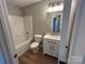Bright bathroom featuring a vanity, a shower-tub combo, and sleek modern finishes at 1820 Wendover Dr, Lancaster, SC 29720