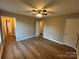 Spacious bedroom with wood-look floors, neutral paint, and multiple closets for ample storage at 1820 Wendover Dr, Lancaster, SC 29720