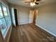 Cozy bedroom with a ceiling fan, hardwood floors, and plenty of natural light at 1820 Wendover Dr, Lancaster, SC 29720