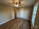 Cozy bedroom with a ceiling fan, hardwood floors, and plenty of natural light at 1820 Wendover Dr, Lancaster, SC 29720