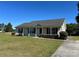 Charming single-story home with a well-maintained lawn, classic black shutters, and inviting curb appeal at 1820 Wendover Dr, Lancaster, SC 29720