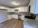 Modern kitchen with white cabinets, stainless steel appliances, and granite countertops at 1820 Wendover Dr, Lancaster, SC 29720
