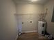 Functional laundry area equipped with essential hookups and a durable water heater at 1820 Wendover Dr, Lancaster, SC 29720