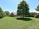 Expansive backyard featuring a patio area with outdoor seating, perfect for entertaining or relaxing outdoors at 202 Cameron Dr, Kings Mountain, NC 28086