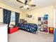 Playful bedroom with a colorful space-themed bed and whimsical decor at 202 Cameron Dr, Kings Mountain, NC 28086