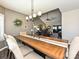 Bright dining room featuring a wooden table with seating for six and an elegant chandelier at 202 Cameron Dr, Kings Mountain, NC 28086