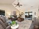 Cozy living room with vaulted ceiling, ceiling fan, and comfortable seating arrangement at 202 Cameron Dr, Kings Mountain, NC 28086