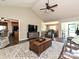 Open concept living room with wood floors, vaulted ceiling, and seamless transition to dining area at 202 Cameron Dr, Kings Mountain, NC 28086