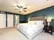 Cozy bedroom with plush carpet, ceiling fan, and natural lighting at 202 Cameron Dr, Kings Mountain, NC 28086