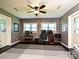 Functional home office with dual workstations, lots of natural light, and a ceiling fan at 202 Cameron Dr, Kings Mountain, NC 28086