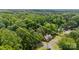 Aerial view of wooded property showcasing boundaries at 203 E College St, Star, NC 27356