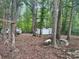 View of lot surrounded by trees with white van and shed at 2206 Meadow Rd, Clover, SC 29710