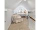 Bright bedroom with vaulted ceilings, sitting area, and plush carpeting offers a relaxing retreat at 2222 Wilmore Dr, Charlotte, NC 28203
