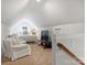 Bright bedroom with vaulted ceilings, sitting area, and plush carpeting offers a relaxing retreat at 2222 Wilmore Dr, Charlotte, NC 28203