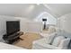Bright bedroom with vaulted ceilings, sitting area, and plush carpeting offers a relaxing retreat at 2222 Wilmore Dr, Charlotte, NC 28203
