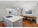 Open kitchen and dining area with a view of the stairs and the front entrance at 2222 Wilmore Dr, Charlotte, NC 28203