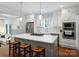 Stylish kitchen featuring a center island with seating, stainless steel appliances, and white cabinetry at 2222 Wilmore Dr, Charlotte, NC 28203