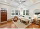 Sun-filled living room featuring hardwood floors, white sectional, and modern furnishings at 2222 Wilmore Dr, Charlotte, NC 28203