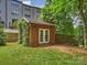 Backyard shed provides extra storage or could be transformed into a hobby space at 2222 Wilmore Dr, Charlotte, NC 28203