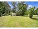 Spacious backyard featuring a shed and lean-to for boat or vehicle storage at 263 Fairway Cir, Rock Hill, SC 29730