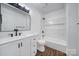 Stylish bathroom with modern fixtures, white vanity, and a shower-tub combination at 263 Fairway Cir, Rock Hill, SC 29730